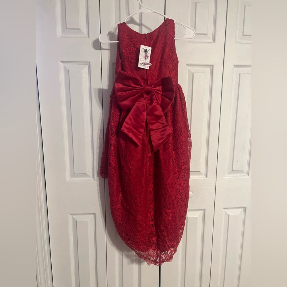 Beautiful high low children’s formal dress 
Never worn, size 12